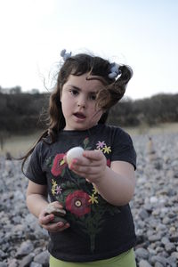 Portrait of a girl holding camera