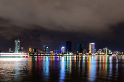 Night view of han river and illuminated buildings in danang city, vietnam