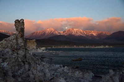 Rock formation at mono lake by mountain