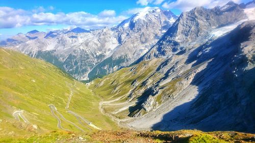 Scenic view of mountains against cloudy sky