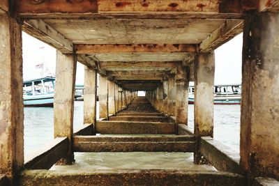 Underneath view of pier over sea
