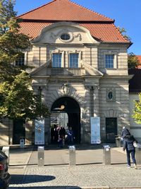 People in front of building