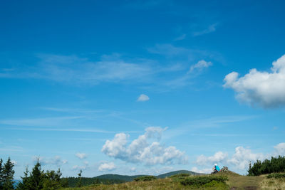 Panoramic view of landscape against blue sky