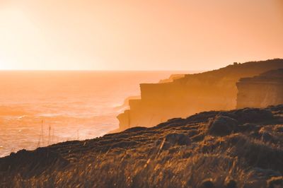 Scenic view of sea against sky during sunset