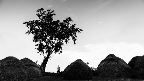 Man standing on field against sky