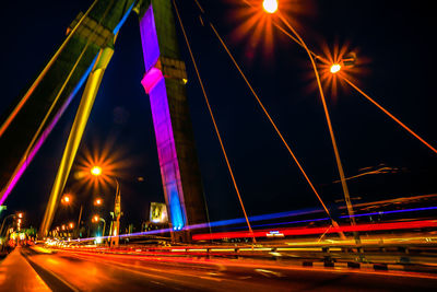 Light trails on suspension bridge at night