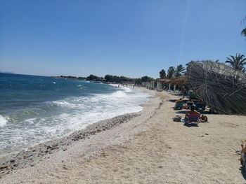 Scenic view of beach against clear sky