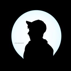 Silhouette man against illuminated light at night