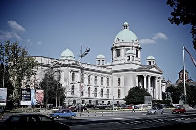 View of buildings in city against sky