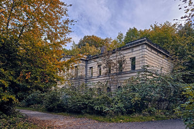 Old building against sky during autumn