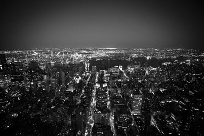 Aerial view of illuminated cityscape at night