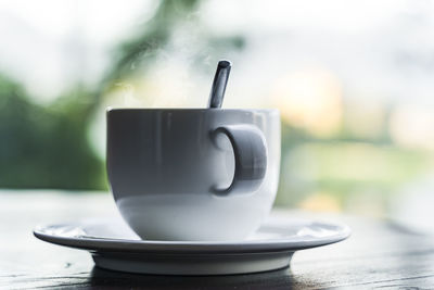 Close-up of coffee cup on table