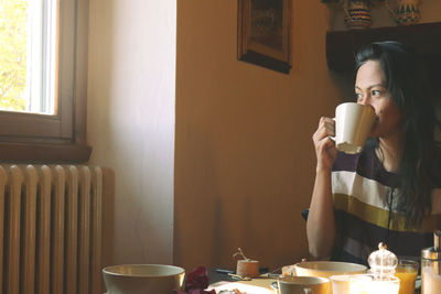 High angle view of man eating food on table