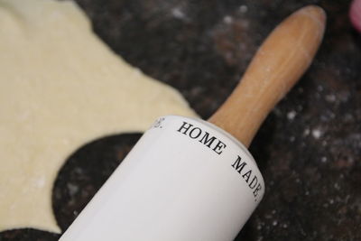 Close-up of text on rolling pin