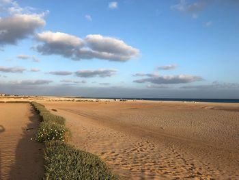 Scenic view of beach against sky