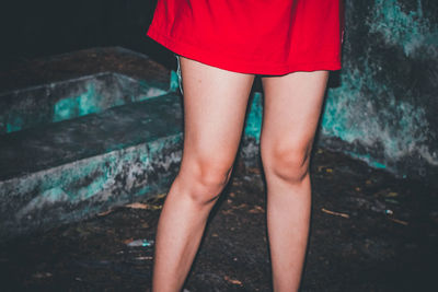 Low section of woman standing on ground