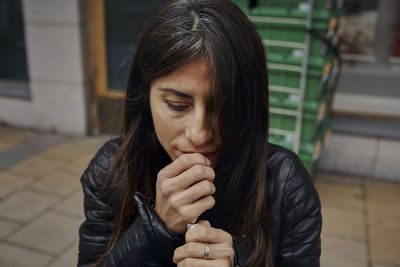 Woman lighting cigarette