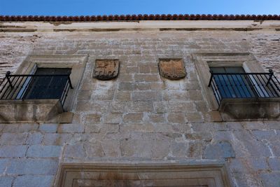 Low angle view of old building against sky