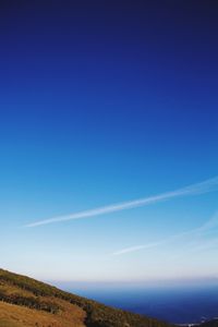 Scenic view of landscape against cloudy sky