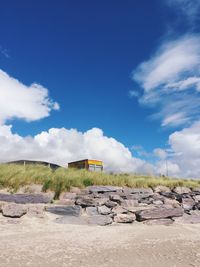 Scenic view of landscape against blue sky