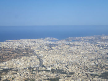 Aerial view of sea against clear sky