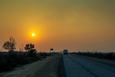 Road against sky during sunset