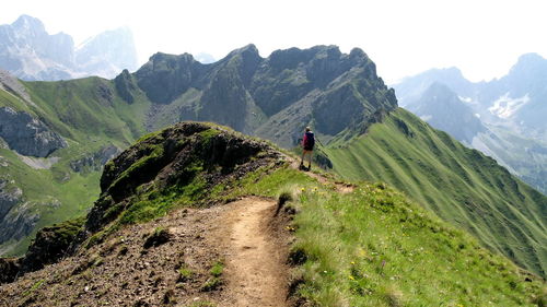 Rear view of man climbing on mountain