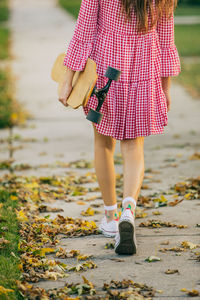 Low section of woman standing on ground