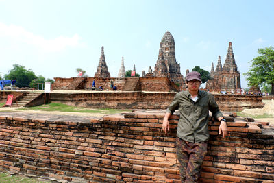 Portrait of man standing outside temple 