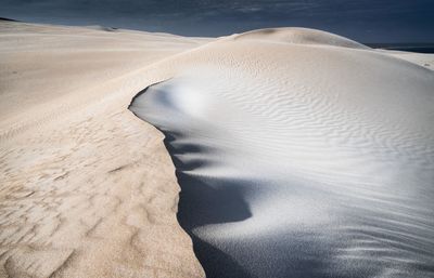 High angle view of sand dunes at beach