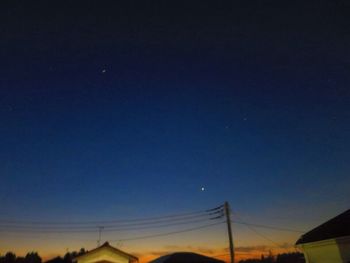 Low angle view of moon in sky at night