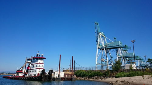 Barge anchored at riverbank