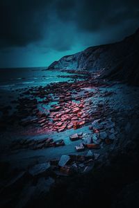 Scenic view of sea against sky at dusk