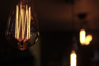 Close-up of illuminated light bulb