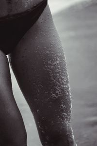 Low section of man on wet surface