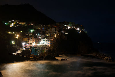Houses on coast at night