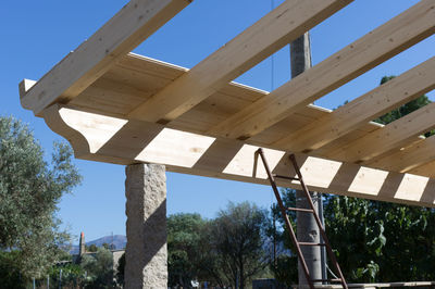 Low angle view of bridge against building