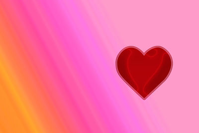 Close-up of heart shape against pink background