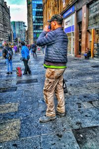 Full length of man standing in city