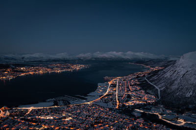 Tromsøysundet tromsø norway landscape and cityscape panorama with mountainous background in winter. 