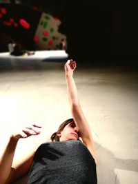 High angle view of woman lying on bed at home