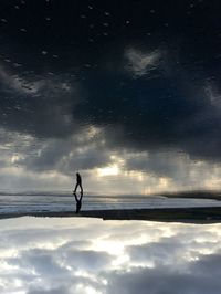 Scenic view of sea against cloudy sky
