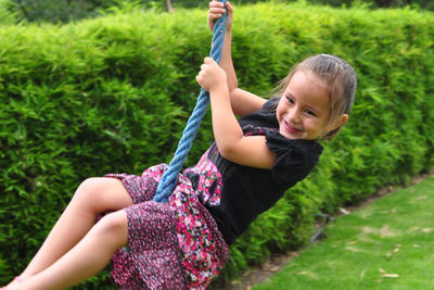 Girl playing in grassy field