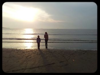 Scenic view of sea at sunset