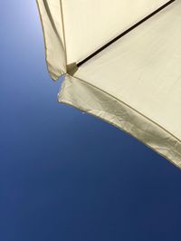 Low angle view of built structure against clear blue sky