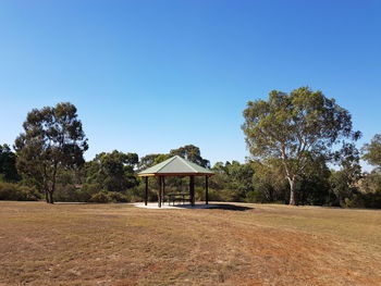 Built structure on landscape against clear sky