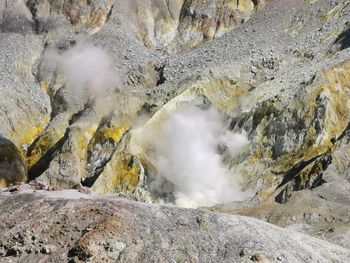 Smoke emitting from volcanic mountain