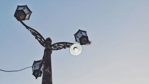 Low angle view of street light against sky