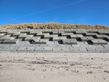 Stone wall against clear sky