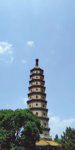 Low angle view of building against blue sky